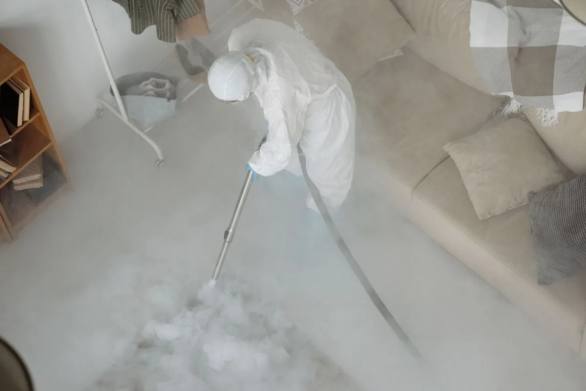 Biohazard cleanup technician in protective equipment, Independence, IA